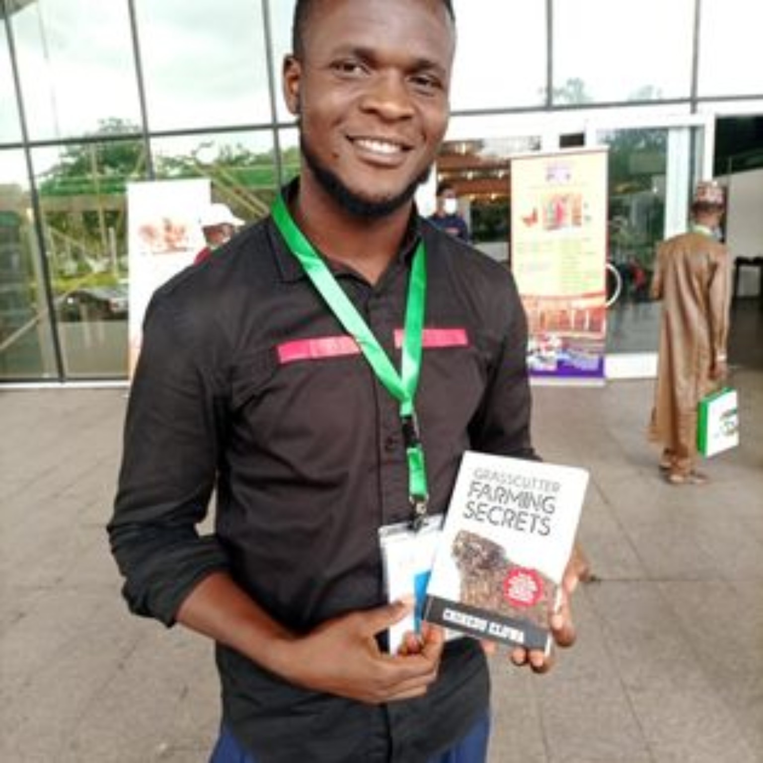 Reader holding their copy of Grasscutter Farming Secrets