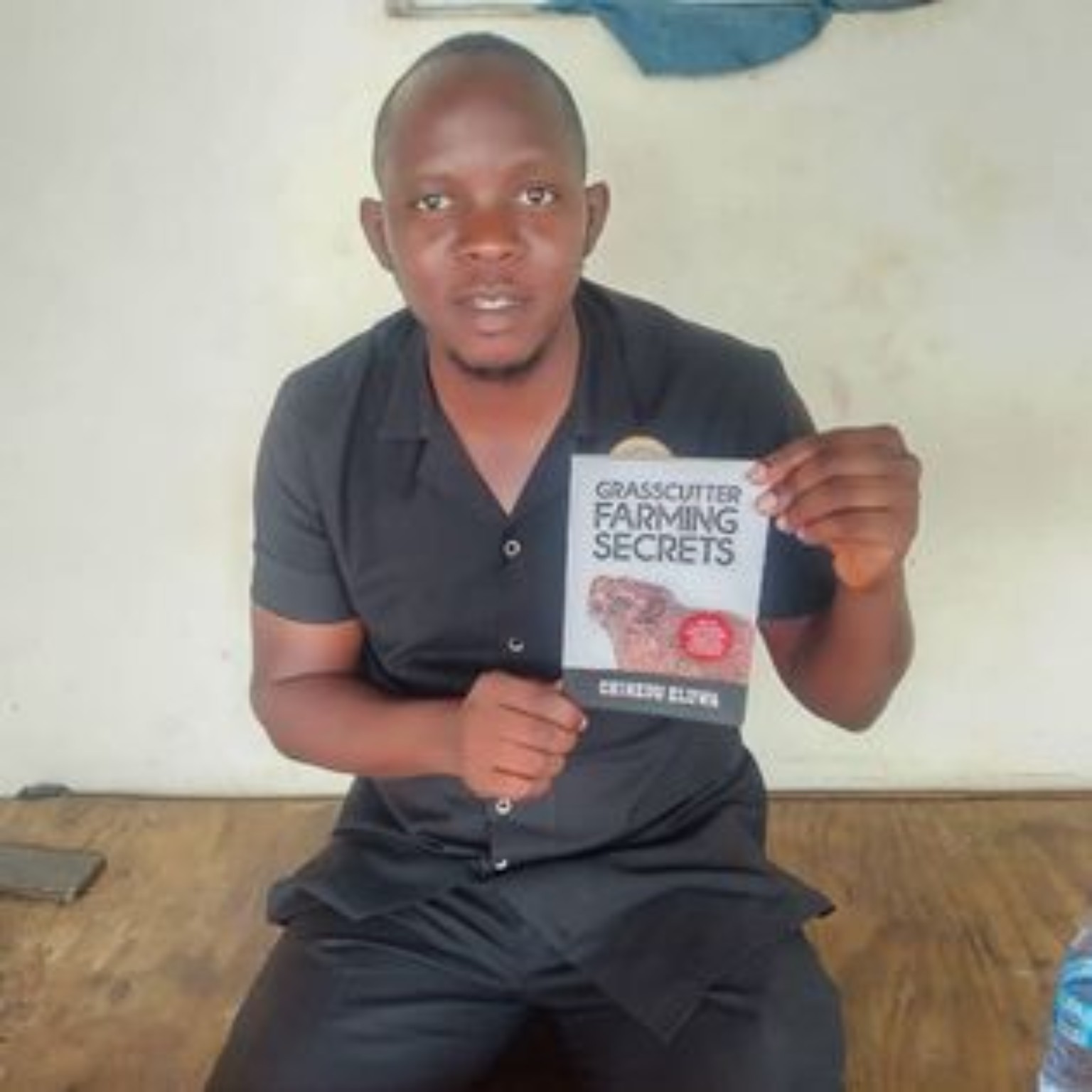 Reader holding their copy of Grasscutter Farming Secrets