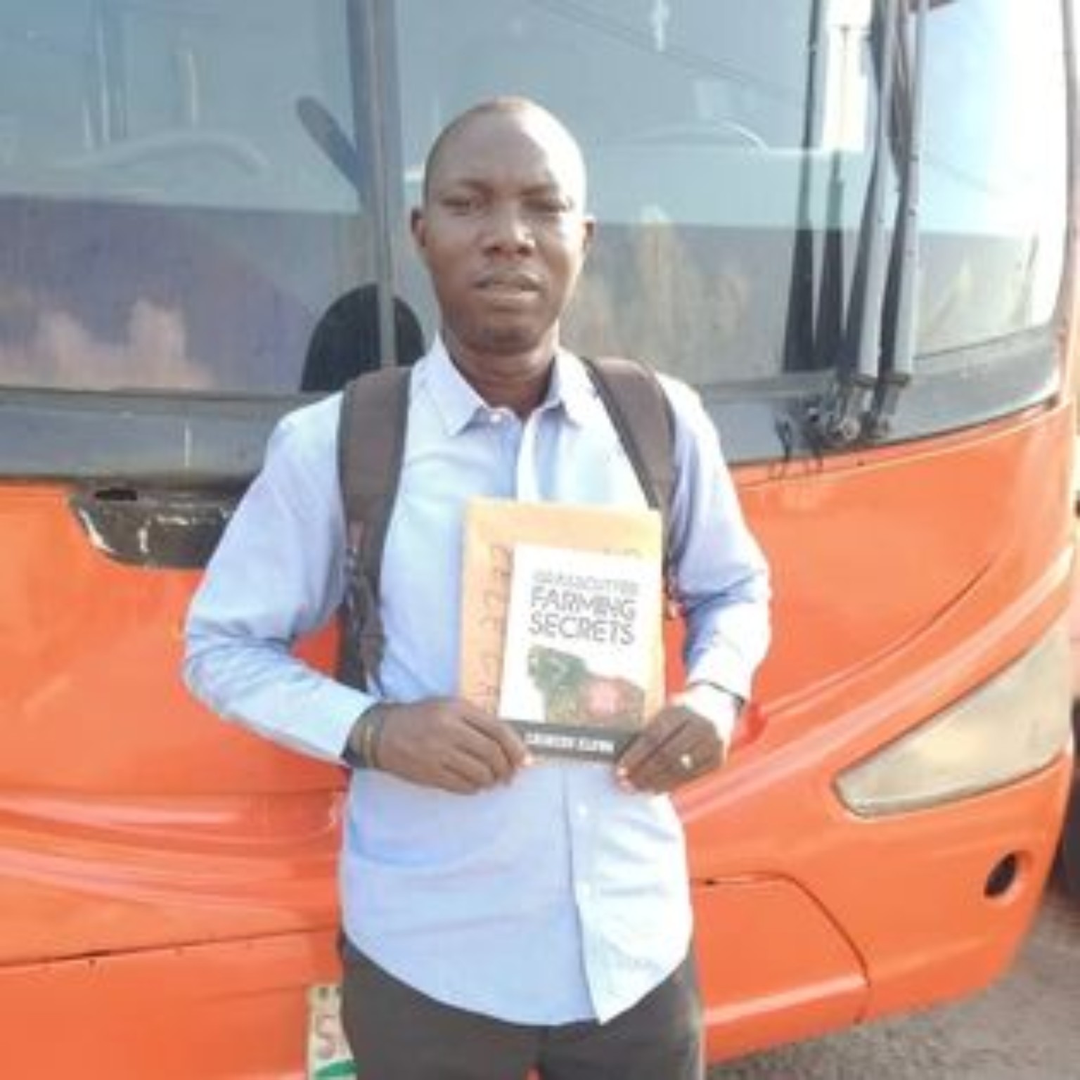 Reader holding their copy of Grasscutter Farming Secrets