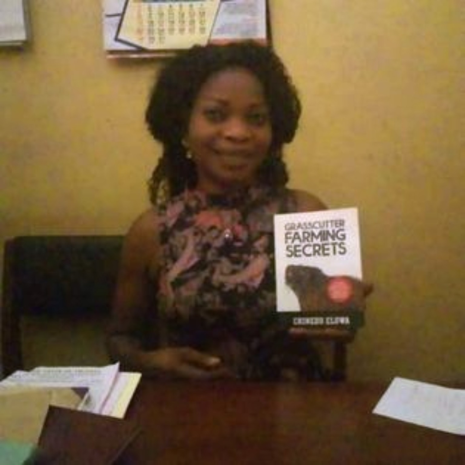 Reader holding their copy of Grasscutter Farming Secrets