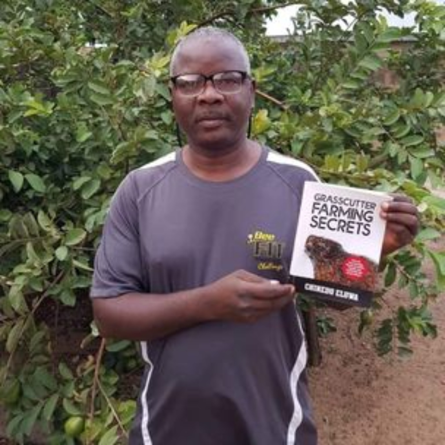 Reader holding their copy of Grasscutter Farming Secrets