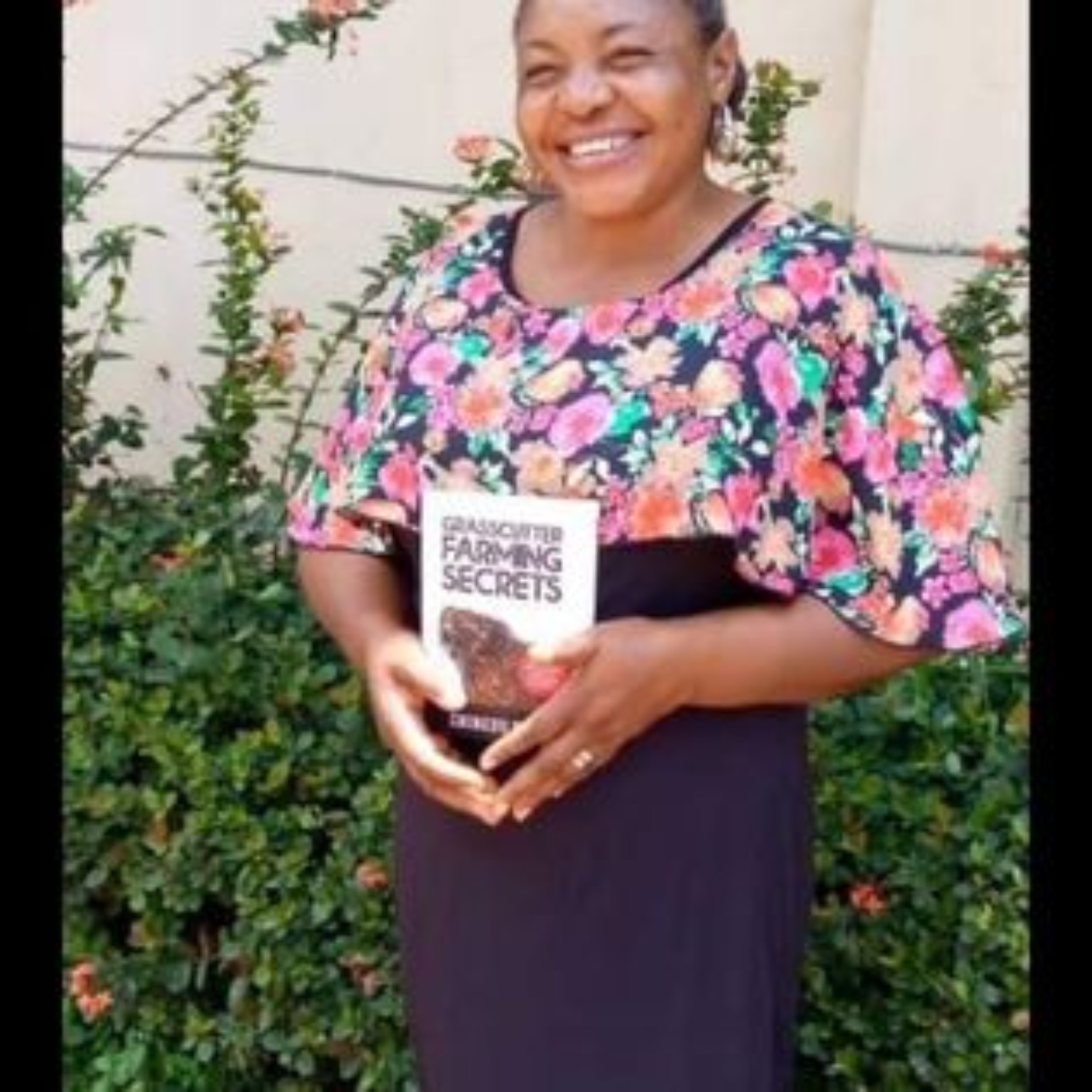 Reader holding their copy of Grasscutter Farming Secrets
